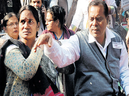 Asha Devi and Badrinath Singh, parents of December 16 gang-rape victim, in New Delhi on Wednesday. DH photo