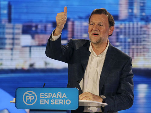 Spanish Prime Minister Mariano Rajoy gestures during an election campaign rally in Coruna, Spain, December 16, 2015. REUTERS