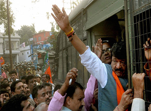BJP Leader Kailash Vijayvargiya along with others being detained during their law violation programme in protest against deteriorating law and order situation in the state at Krishnanagar in Nadia district of West Bengal on Thursday. PTI Photo