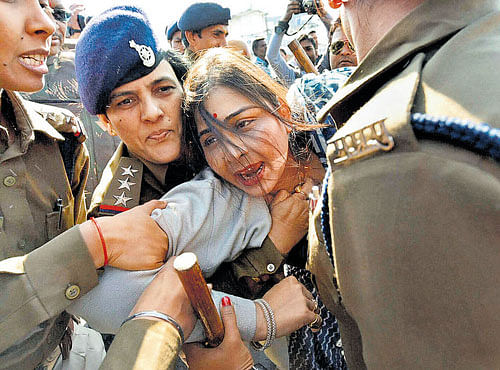 Police arrest Congress activists during a protest against Prime Minister Narendra Modi in Bhopal on Saturday. PTI