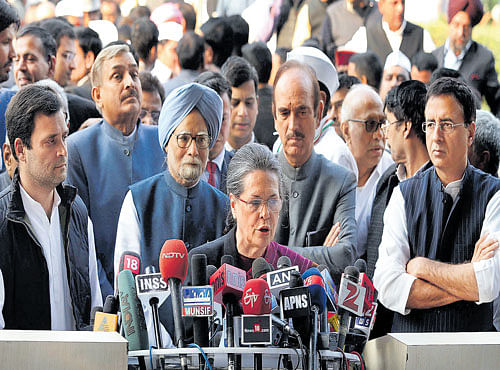 UNITED STAND: Congress president Sonia Gandhi addresses the media flanked by Rahul Gandhi, former prime minister Manmohan Singh and other party leaders in New Delhi on Saturday. DH PHOTO