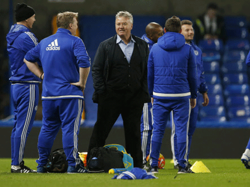 New Chelsea manager Guus Hiddink on the pitch after the game. Reuters Photo.