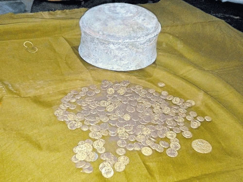 The ancient gold coins that were found in a copper container during excavations at a fort in Thirthahalli taluk of Shivamogga district on Saturday. DH photo