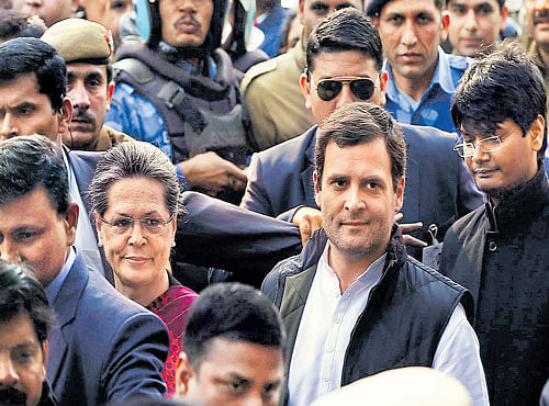 Congress president Sonia Gandhi and vice-president Rahul Gandhi arrive at a court in New Delhi on Saturday. REUTERS