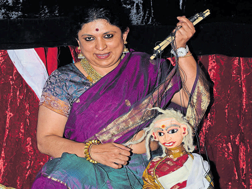 A puppeteer with a puppet at the Dhaatu show