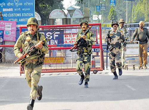 Border Security Force personnel perform security drills at the Attari Border Post on Sunday