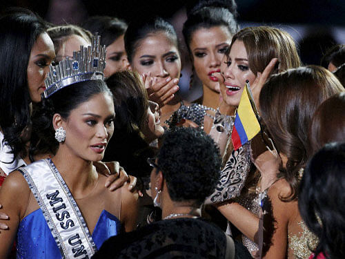 Other contestants comfort Miss Colombia Ariadna Gutierrez, top right, after she was incorrectly crowned Miss Universe at the Miss Universe pageant Sunday, Dec. 20, 2015, in Las Vegas. AP/ PTI