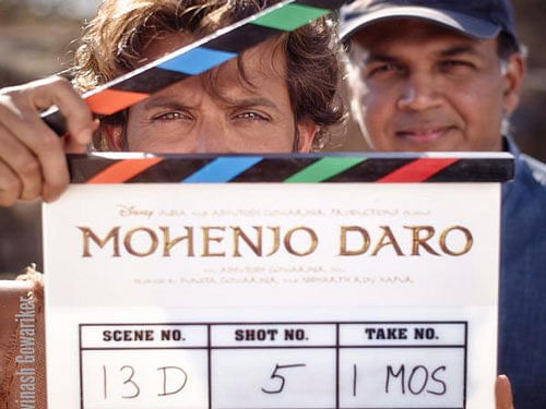 Hrithik Roshan is seen holding  clapperboard on the sets of Mohenjo Daro movie. Courtesy: Twitter
