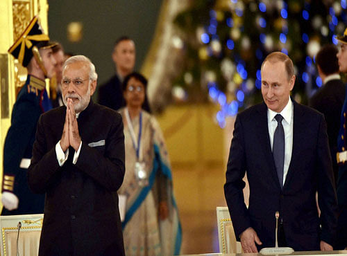 Prime Minister Narendra Modi with President of the Russian Federation Vladimir Putin at a meeting with Russian and Indian CEOs in Kremlin Moscow on Thursday. PTI