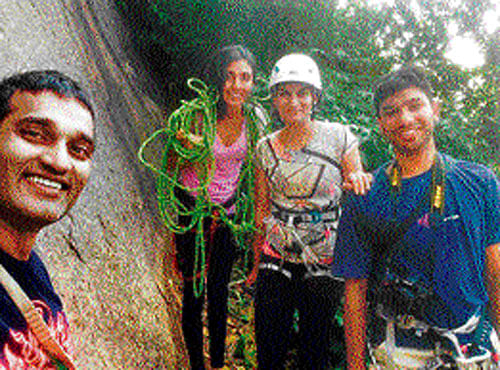 Members of the Bangalore Climbing Group click a selfie.  A member climbs one of the hills on the City's outskirts. Photos by special arrangement