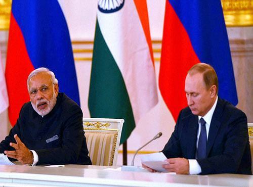 Prime Minister Narendra Modi with Russian President Vladimir Putin during press statement in Kremlin, Moscow on Thursday. PTI Photo