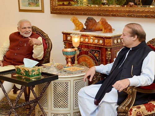 Pakistani Prime Minister Nawaz Sharif talks with his Indian counterpart Narendra Modi in Lahore. REUTERS