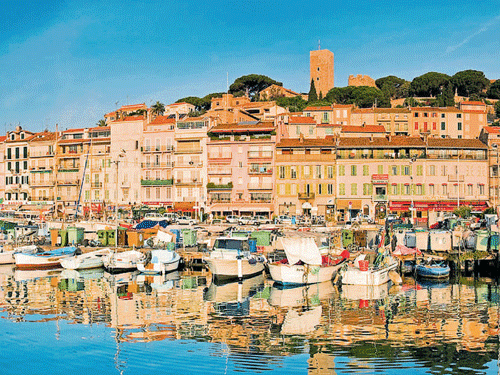 Cool retreat Colourful boats dot the waters at Cannes in France.