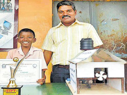 Jayakumar along with his teacher with the cost-effective device to put off fire in cracker units.