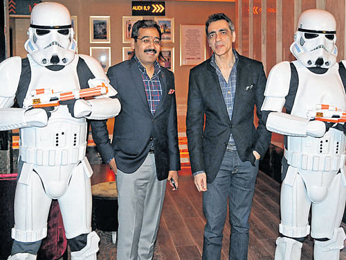Ajay Bijli (right) and Gautam Dutta flanked by Stormtroopers at the new PVR cinema in Bengaluru on Monday. DH&#8200;Photo