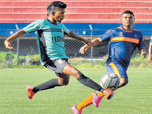 ON THE MOVE Mani (left) of South United tries to get past Amit of ASC in their Super Division tie on Tuesday. DH PHOTO