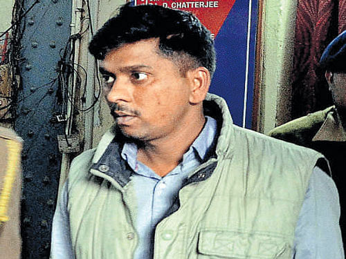 Army jawan Manjrish Tripathy, arrested for his involvement in the gang-rape of a teenage girl, taken to a court in Howrah on Tuesday. PTI