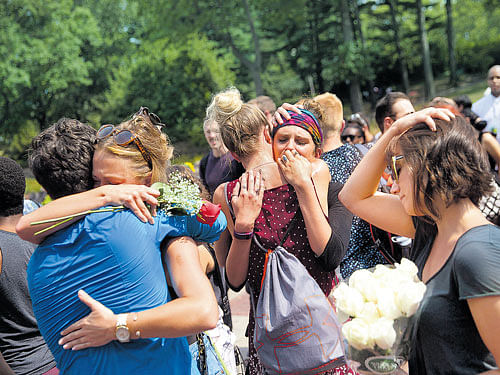 unbearable grief: Friends, castmates and onlookers at Central Park to honour actor Kyle Jean-Baptiste (inset), who died after falling from a fire escape in New York in August. Today, through social media, death lingers longer than a traditional mourning period might call for. nyt