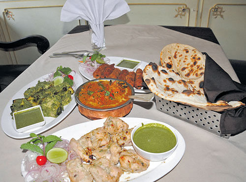 INVITING 'Murgh malai tikka', 'Paneer pudina tikka', 'mutton seekh kabab' and butter chicken with 'naans'. DH PHOTOS