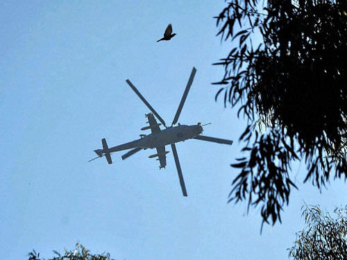 A chopper hovers over the Indian Air Force base that was attacked by militants in Pathankot, Punjab. The Pathankot IAF facility, located about 40 kms away from the border with Pakistan, is the base of MiG-21 fighter planes and Mi-25 attack helicopters of the Indian Air Force. PTI photo