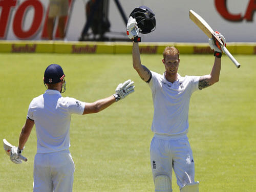 England's Ben Stokes celebrates scoring a double century with Jonny Bairstow during the second cricket test match against South Africa in Cape Town, South Africa. Stokes slammed 204 not out as England reached 513 for five at lunch. Reuters photo