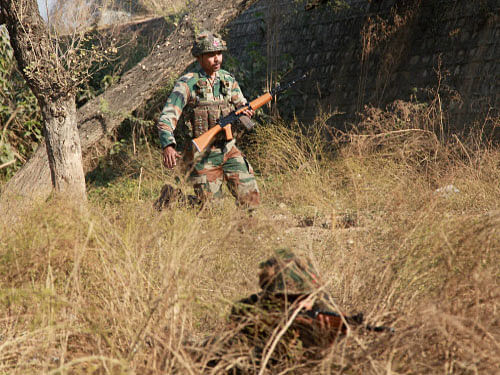 Army soldiers conduct search operations in a forest area near the Air force base in Pathankot on Sunday. PTI photo