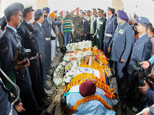 Jawans paying tribute to Commando of Indian Air Force Gurusewak Singh at his native village Garnala in Ambala on Monday. Gurusewak Singh was killed in the terror attack in Pathankot. PTI Photo