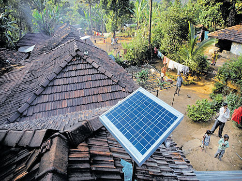 Solar panels sit on houses in Paradeshappanamatha in Karnataka. About a quarter of the world's off-the-grid people (about 300 million) live in India, mostly in remote, rural communities such as this or in informal urban settlements. NYT