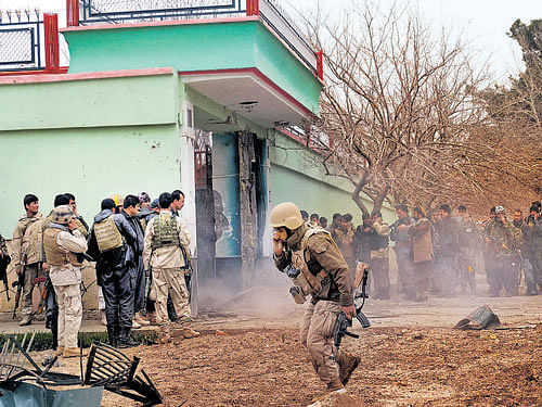 battle ends: Security forces surround a house which is used by a group of gunmen to attack the Indian Consulate in Mazar-e-Sharif in Afghanistan on Monday. PTI