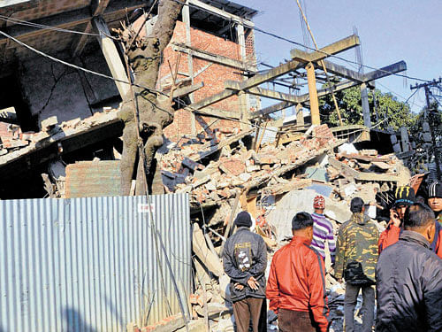 1) A collapsed building after a massive earthquake rocked Imphal in Manipur on Monday. PTI
