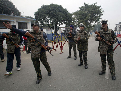 Security personnel stand guard inside the IAF base at Pathankot in Punjab on Monday. REUTERS photo