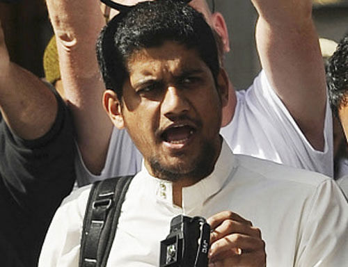 A file picture shows a man identified by local media as Siddharta Dhar as he takes part in a demonstration outside the U.S. embassy in central London, September 11, 2011. Dhar is widely identified by local media as the masked figure with a British accent in the latest video distributed by ISIS which shows the execution of 5 men. Reuters