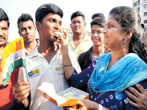 celebration time Pranav Dhanawade is offered sweets by his mother after smashing a  jaw-dropping 1009 not out in an inter-school match on Tuesday. pti