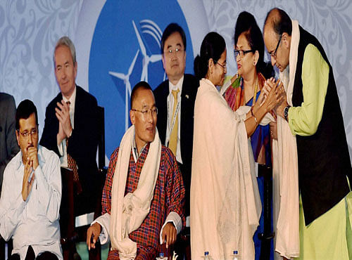 West Bengal Chief Minister Mamata Banerjee felicitates Finance Minister Arun Jaitley while Delhi Chief Minister Arvind Kejriwal and Bhutan Prime Minister Tshering Tobgay look on during Bengal Global Business Summit in Kolkata on Friday. PTI Photo
