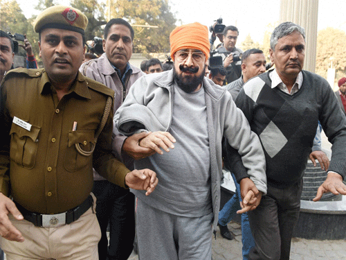 Pearl Group Chairman-cum-Managing Director Nirmal Singh Bhangoo being produced by CBI at Tis Hazari court in New Delhi on Saturday in connection with Rs 45,000-crore scam. PTI Photo.