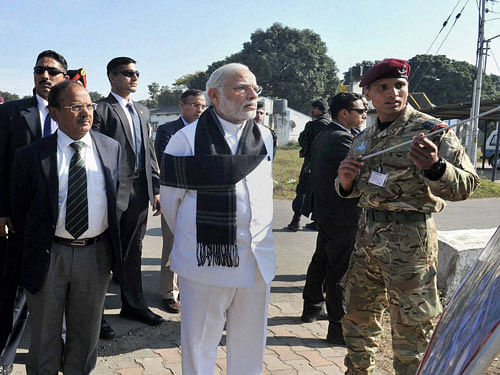Indian Prime Minister Narendra Modi watching a presentation on counter-terrorist and combing operation by the Defence Forces, at Pathankot Airbase on Saturday. National Security Adviser Ajit Doval, Chief of Army Staff General Dalbir Singh and Air Chief Marshal Arup Raha are also seen. PTI Photo