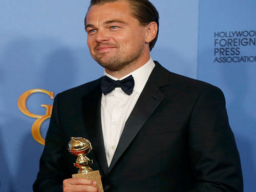 Leonardo DiCaprio poses with the award for Best Performance by an Actor in a Motion Picture - Drama for his role in 'The Revenant', reuters photo