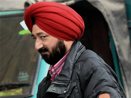 Superintendent of Police Salwinder Singh arrives to appear before NIA in New Delhi on Wednesday. PTI