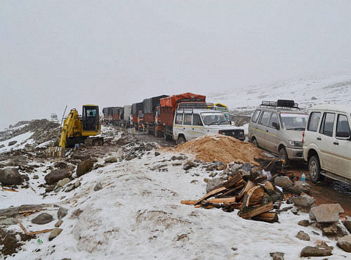 A view of stranded vehicles on Mughal Road following heavy snowfall at Poonch in Jammu and Kashmir. PTI Photo