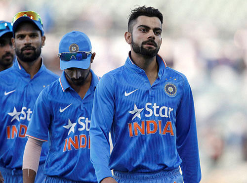 India's Virat Kohli, right, walks off the ground with teammates after being defeated by Australia in their one day international cricket match in Perth, Australia, Tuesday, Jan. 12, 2016. PTI