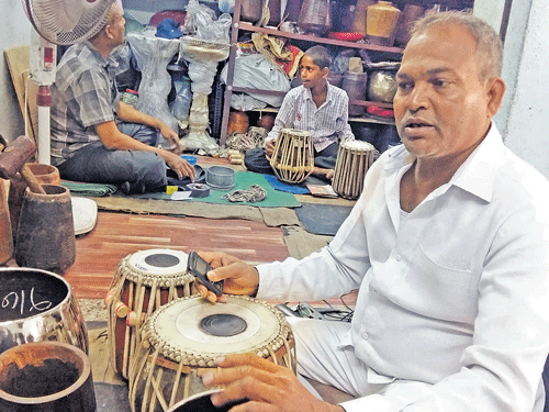 Akber and Nayeem in the background of Akbar Miya & Brothers, the legendary tabla makers of Hyderabad. Umanadh JBS