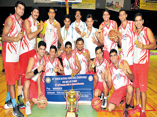 Champions Services men, winners of 66th Senior Nationals Basketball Championship. STANDING (From left) Ashutosh Rai, SM Settu, Jayram Jat, G Sai Venkatesh (coach), Jora Singh (coach), RS Rawath (trainer), Saurabh, Mayur R Bhat, Joginder Singh. (KNEELING) NK Grewal, Mahipal Singh, Akhilesh Tudu, Vupin K, Rohith Gulia, Hemanth Sheoran. DH Photo/IRSHAD MAHAMMAD