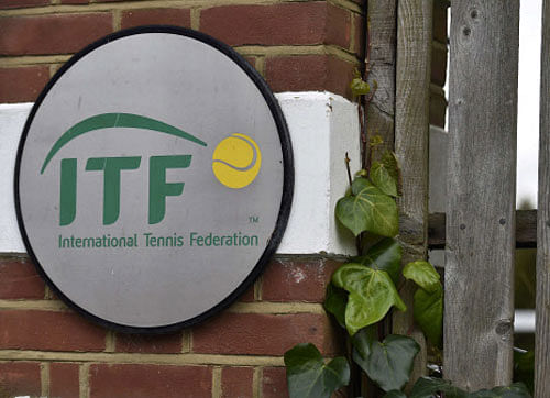 A logo is seen at the entrance to the International Tennis Federation headquarters, where the Tennis Integrity Unit is based, in London