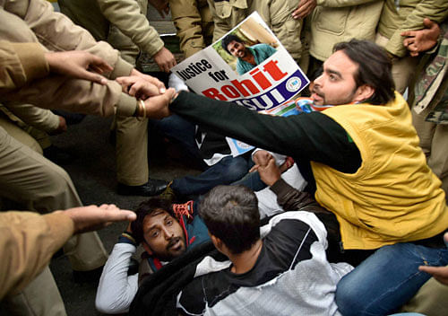 Police detain Youth Congress workers during a protest against the Ministry of Human Resource Development in New Delhi on Tuesday, over the suicide of Dalit student Rohith Vemula at University of Hyderabad. PTI Photo