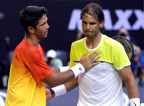 Rafael Nadal, right, of Spain is consoled by compatriot Fernando Verdasco after his first round loss to Verdasco at the Australian Open tennis championships in Melbourne, Australia. PTI