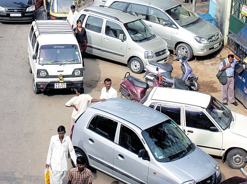 Haphazard and illegal parking is common on City's choked roads. dh photo