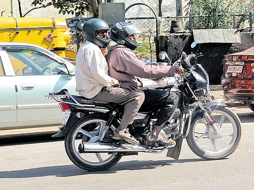 Bengaluru police started cracking the whip on helmetless pillion riders on Wednesday. DH&#8200;photo
