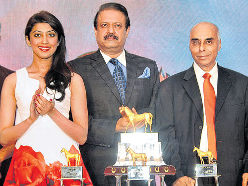 setting the stage (From left) Actress Pranitha Subhash, Garuda Group managing director Uday Garudachar and Bangalore Turf Club chairman AC Satish Chandra at the trophy unveiling ceremony of Garuda Bangalore Derby on Thursday. dh photo