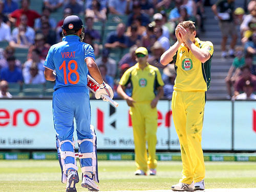 Australia's James Faulkner shows his frustration at a near miss against India's Virat Kohli during their One Day cricket match at the Melbourne Cricket Ground, Reuters photo