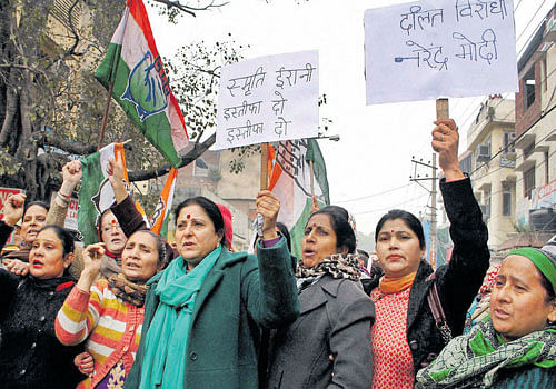 Congress workers shout slogans against HRD Minister Smriti Irani in Jammu on Friday.  PTI